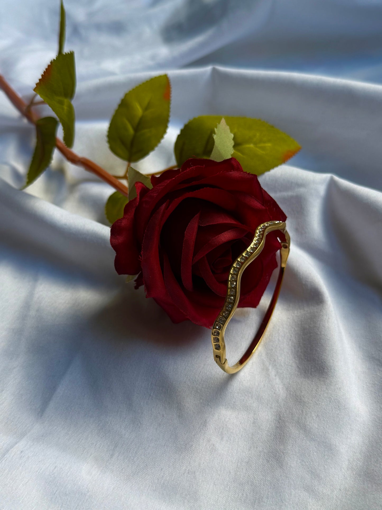 Waves gold bangle