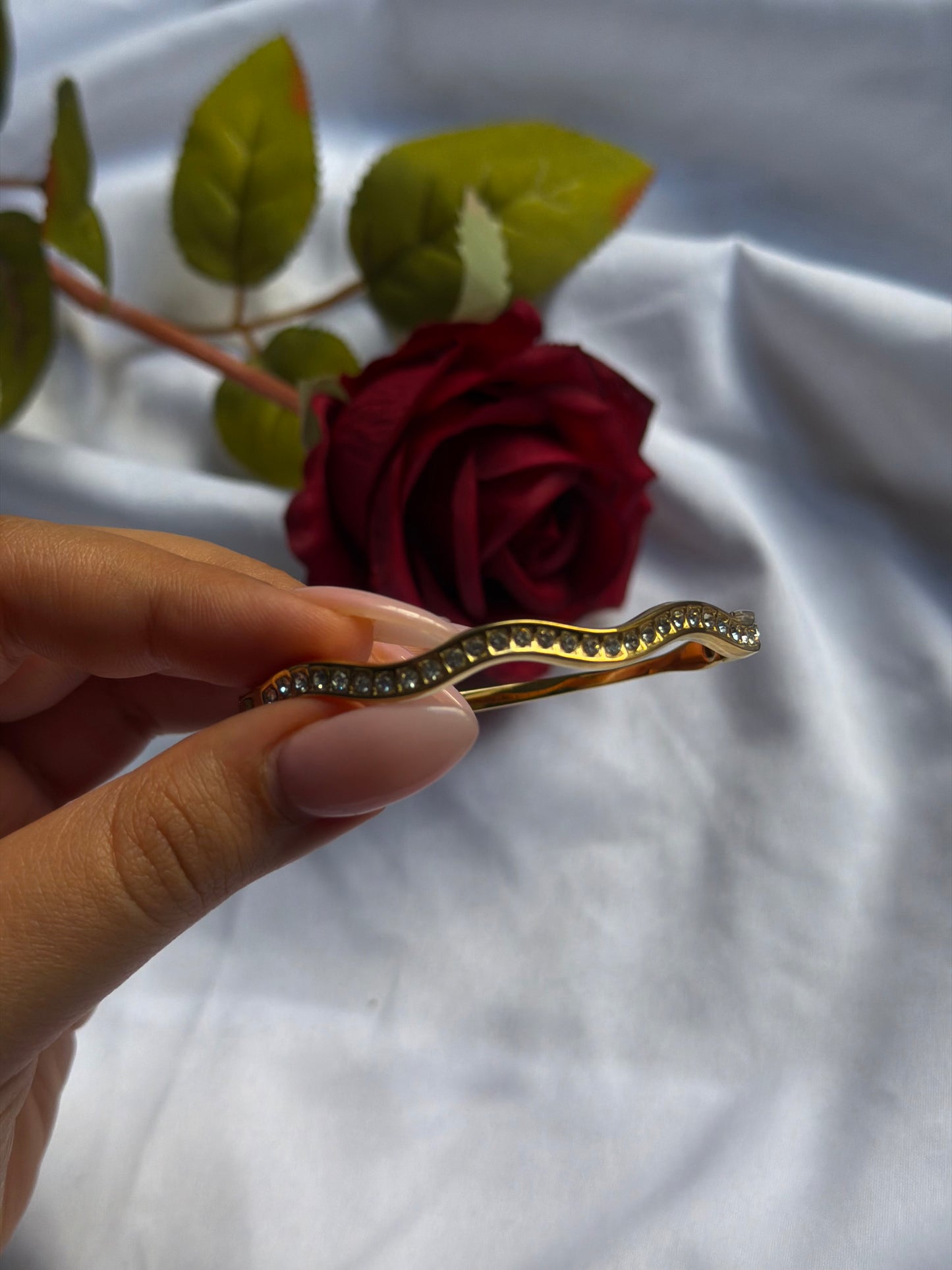 Waves gold bangle